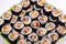 Top view of stack of Japanese sushi maki roll plate
