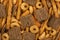 Top view on a stack of salty party mix food as abstract background.