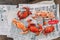 Top view Steamed Flower Crabs and Giant Mud Crabs with separated parts of steamed crab such as claw meat and body on newspaper.