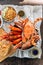 Top view of Steamed Giant Mud Crabs, Grilled Prawns Shrimps, Crab Fried RIce, Pepper and Garlic Soft-Shell Crab, Crispy Catfish
