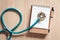 Top view of stethoscope on calendar for health checkup concept., Annual doctor appointment for physical check-up against wooden