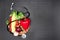 Top view of stethoscope,various organic vegetables and fruits on grey