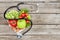 Top view of stethoscope,various organic vegetables and fruits on wooden surface