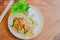 Top view, Stir Fried Rice Noodle with Prawns with  Bean sprouts in dish ,thai food on wood