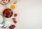 top view of strawberries in bowl with cottage cheese butter milk oats on left side and white background with copy space