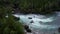 Top View Of Strong Current Of Blue River Amidst The Rocky Cliff. aerial