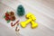Top view studio shot of Christmas eve and New year festival decorative items small Mockup Xmas tree Pine seeds Cherry fruit Candy
