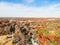 Top view suburbs Dallas houses near park forest with colorful autumn color