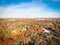 Top view suburbs Dallas houses near park forest with colorful autumn color