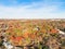 Top view suburbs Dallas houses near park forest with colorful autumn color