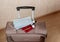 Top view of a suitcase with a passport, medical mask and Covid-19 vaccine. Concept: coronavirus vaccination and travel