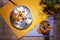 Top view of a summer dessert. Vanilla ice cream and jar of apricot juice on a wooden background. Creamy organic snacks.