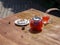 Top view of a summer fruit tea with fresh strawberries and natural currant on a wooden background. Healthful breakfast.