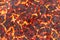 Top view surface lava rocks rough smelt, hot magma ground texture, burning coals planet or volcano background. Light shadow.