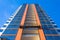 Top view Suspended elevator on a high residential building under construction, decoration of the facade and windows