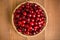 Top view of sweet cherry berries (Prunus avium) in wicker plate