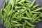 Top view of sweet fresh peas in pods and peas seeds on top of heap