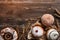 Top view of sweets donuts and pretzel or cracknel and lemon slice dry on wooden background with copy space