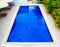 Top view of swimming pool with clear blue water in resort, outdoor architecture