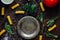 Top view of table with italian tortiglioni pasta, metal plate and spices.