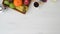 Top view of table in living room with copy space, fruit basket, coffee cup and moka pot on  white wooden table