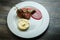 top view on tasty barbecued meat pieces with potato puree and sauce