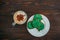 top view of tasty cappuccino and cookies in shape of clovers