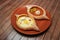 Top view on tasty traditional Adjarian Khachapuri - open baked pie with melted salt cheese suluguni and egg and