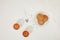 top view of tea in glass cups, spoon, sugar cubes and oatmeal cookies on plate