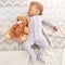 Top view, teddy bear and baby sleeping in bed for rest, nap time and dreaming in nursery. Childcare, newborn and cute