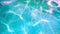 Top view of texture of clean blue surface of pool water with light reflections. Slow motion net, sunlight refraction, water, backg