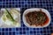 Top view, Thai food, Isan style food, Larb minced pork with chili and herbs with fresh vegetables and side dishes placed