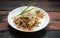 Top view Thai food Pad Thai chicken on rustic wooden table