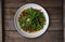 Top view Thai food stir fried morning glory on rustic wooden table