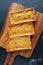 Top View of Three of Fresh Baked Pumpkin Pie on Wooden Breadboard