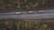 Top view three truck cars with freight container driving on suburban road