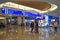 Top view of Ticketing and Check-in blue sign and Visitor Information touch screen at Orlando International Airport .