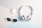 Top view to essential summer accessories sunglasses, earphones a