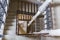 Top view to old castle indoor stair with wood handrail