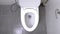 Top view of toilet flushed. A water flushing down into the toilet bowl in bathroom. Slow motion shot of water being flushed