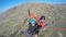 Top view of tourist paragliding