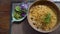 Top View of Traditional Lanna Style Dish - Khao Soi Soup with Crispy Noodles. Authentic Nothern Thai Cuisine