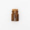 Top view of transparent empty brown glass jar bottle with closed cork cap lids on white background