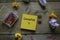 Top view of trash paper,paper clips, and yellow sticky notes written with Generation Y on wooden background
