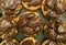 Top View of a Tray of French Choux Pastries with Chocolate Ganache