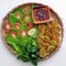 Top view tray of Vietnamese vegan food, green bean pies with salad