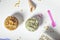 Top view of tubs of artisan ice cream of various flavors on a white background