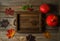 Top view of two autumn pumpkins, maple leaves, and branch of rowan berries on wooden rustic background. Concept shot