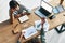 Top view of two pretty businesswomen having a meeting in office