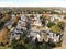 Top view two story townhomes surrounded by colorful fall foliage in suburbs Dallas, Texas, America